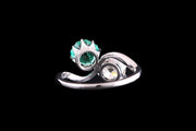 Art Deco French Platinum Diamond and Emerald Two Stone Twist Ring