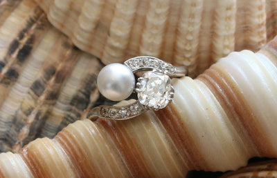 Latest Advert - Platinum Diamond and Pearl Two Stone Ring