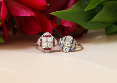 Latest Advert - An 18ct White Gold and Platinum Diamond and Ruby Dress Ring & 18ct Yellow Gold and White Gold Diamond and Sapphire Dress Ring