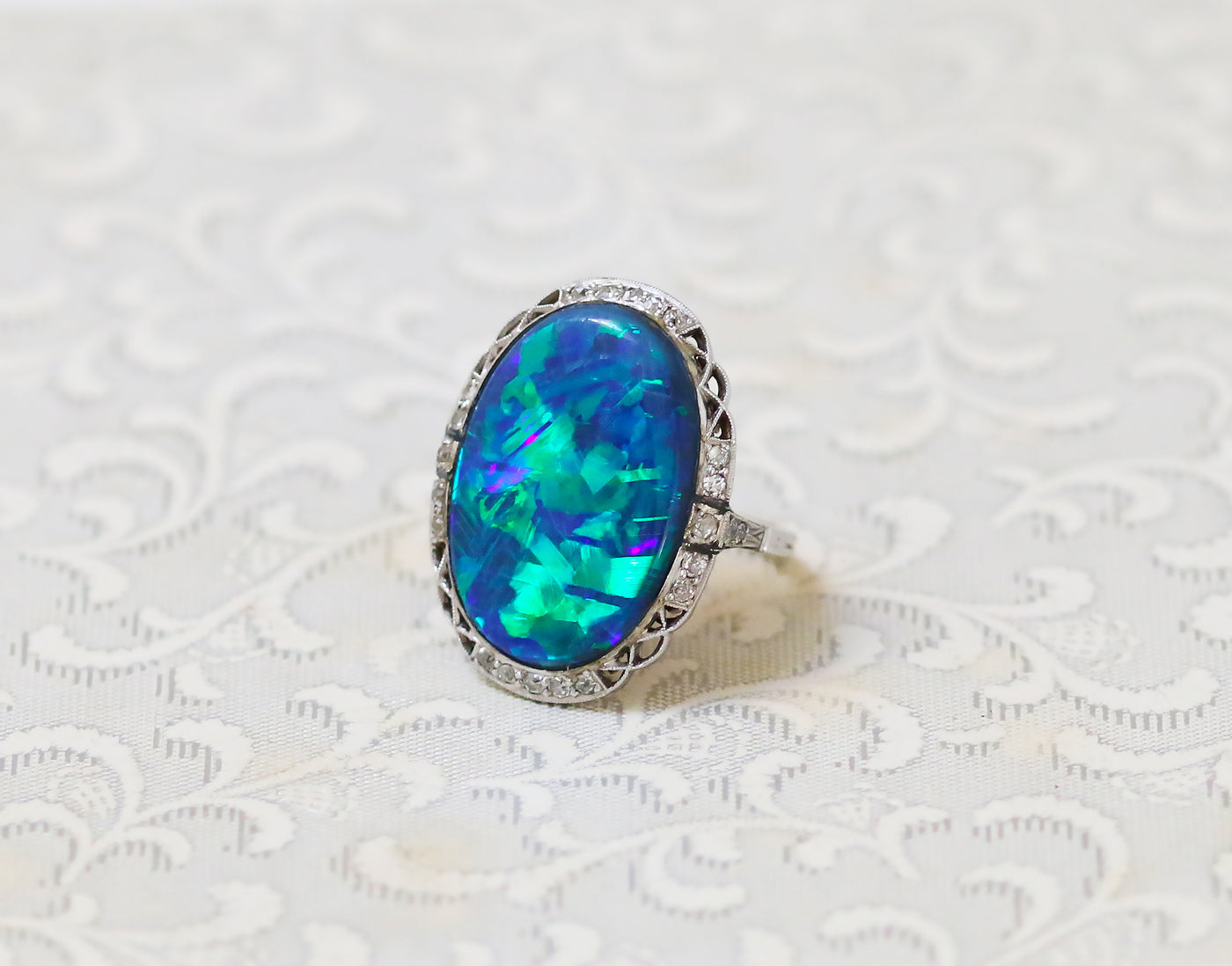 Latest Advert - Art Deco 18ct White Gold Diamond and Black Opal Oval Cluster Ring