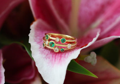 Latest Advert - 18ct Yellow Gold Diamond and Emerald Triple Row Dress Ring