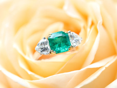 Latest Advert - Platinum Diamond and Emerald Three Stone Ring