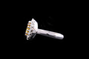 Platinum Diamond and Yellow Sapphire Oval Cluster Ring with Diamond Shoulders