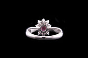 Platinum Diamond and Ruby Oval Cluster Ring