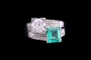 Art Deco 18ct White Gold Diamond and Colombian Emerald Two Stone Twist Ring with Diamond Shoulders
