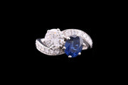 18ct White Gold Diamond and Sapphire Two Stone Twist Ring with Diamond Shoulders