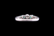 Art Deco Platinum Diamond and Emerald Three Stone Ring with Diamond Shoulders