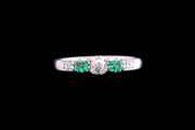 Art Deco Platinum Diamond and Emerald Three Stone Ring with Diamond Shoulders