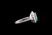 Platinum Diamond and Emerald Oval Cluster Ring with Diamond Shoulders