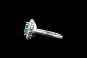 Platinum Diamond and Emerald Oval Cluster Ring with Diamond Shoulders