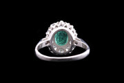 Platinum Diamond and Emerald Oval Cluster Ring with Diamond Shoulders