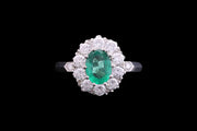 Platinum Diamond and Emerald Oval Cluster Ring with Diamond Shoulders