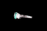 Platinum Diamond and Emerald Three Stone Ring