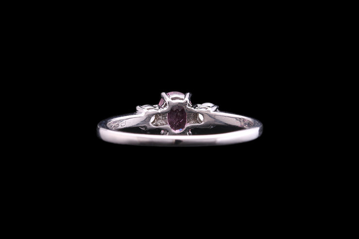 18ct White Gold Diamond and Pink Sapphire Three Stone Ring