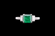 Platinum Diamond and Emerald Three Stone Ring with Diamond Shoulders