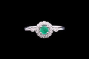 18ct White Gold Diamond and Emerald Halo Ring with Diamond Shoulders