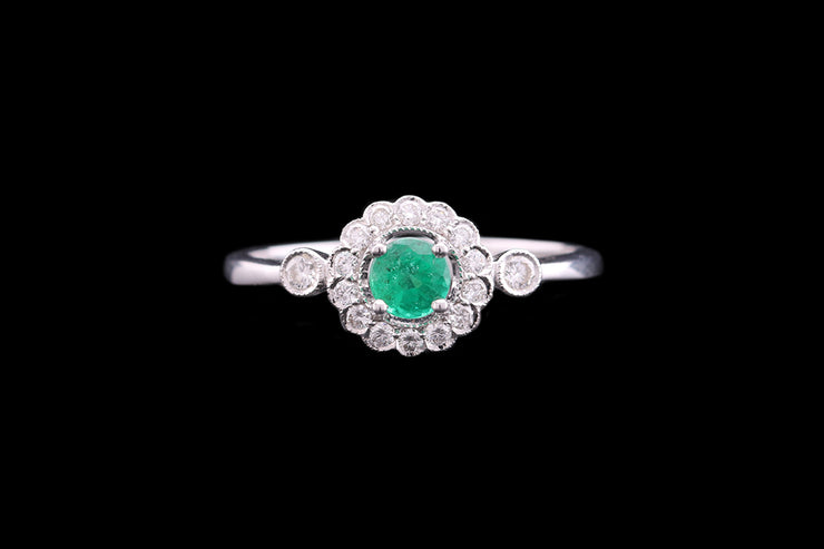 18ct White Gold Diamond and Emerald Halo Ring with Diamond Shoulders