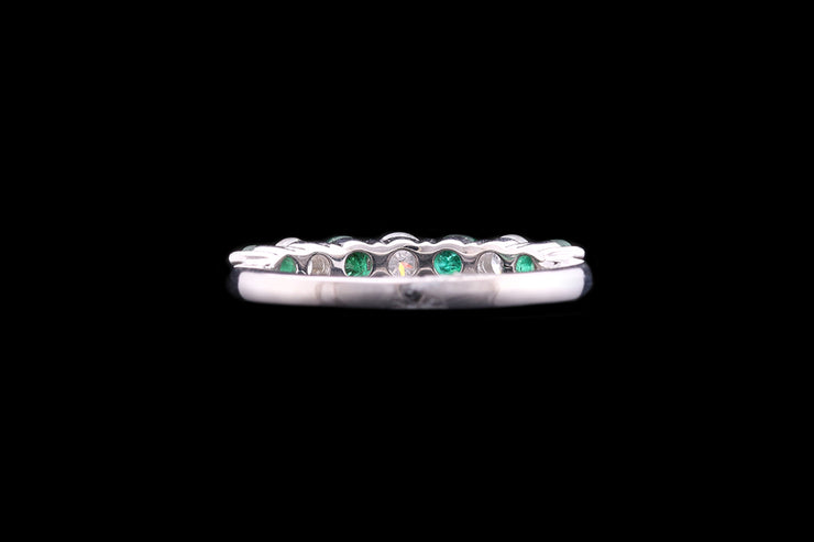 Platinum Diamond and Emerald Seven Stone Ring