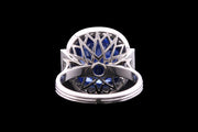 Platinum Diamond and Sri Lankan Sapphire Cluster Ring with Diamond Shoulders